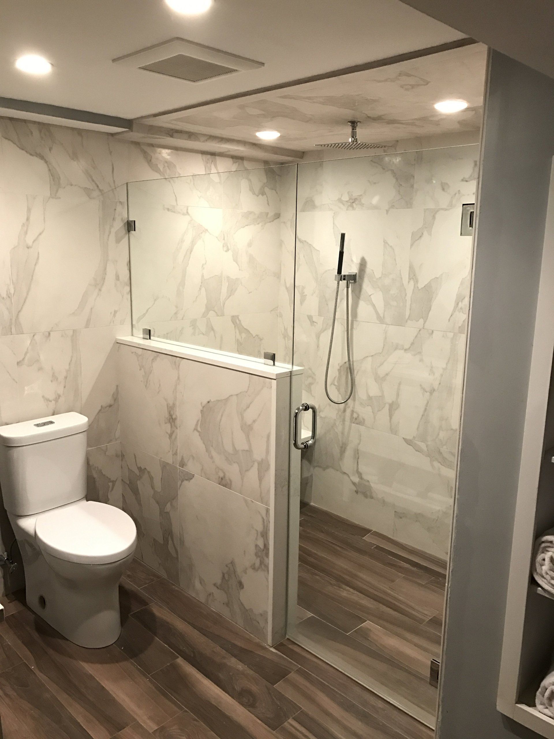 Hardwood floor looking tiles in a curbless shower