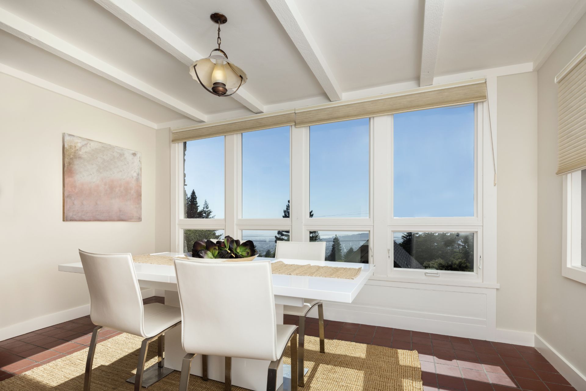 White dining room with four windows