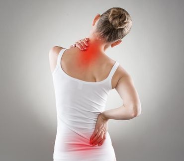 Person holding neck and lower back with red pain highlights on white background