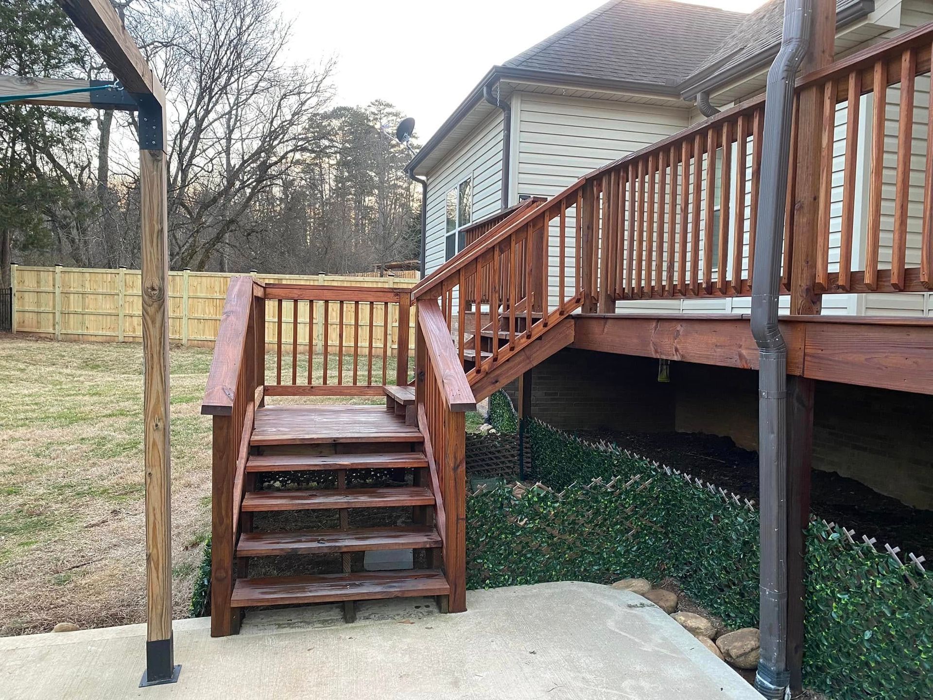 A wooden deck with stairs leading up to it