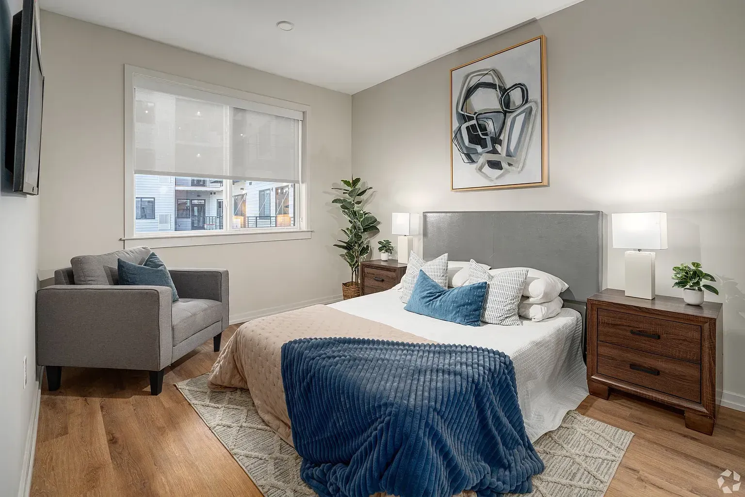 Photo of a bedroom with plenty of natural light and high ceilings