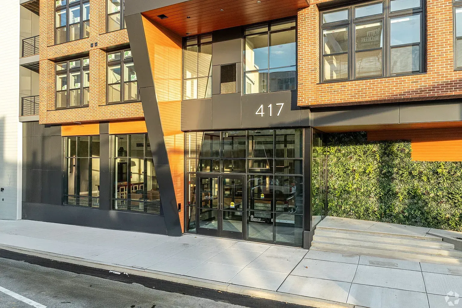 Photo of the entrance to the building showing glass doors