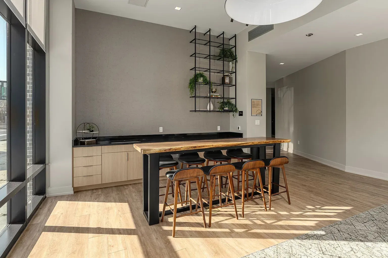 Photo of a community lounge with plenty of natural lighting and walking space