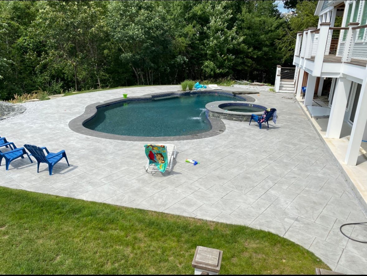 An intricate and elegant stamped concrete texture pattern resembling natural stone.