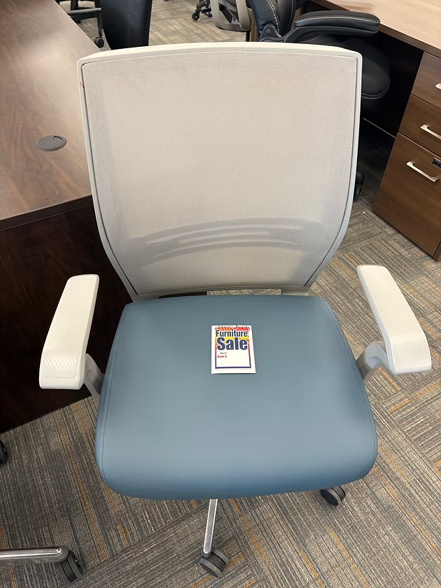 Blue and gray office chair with white mesh back,