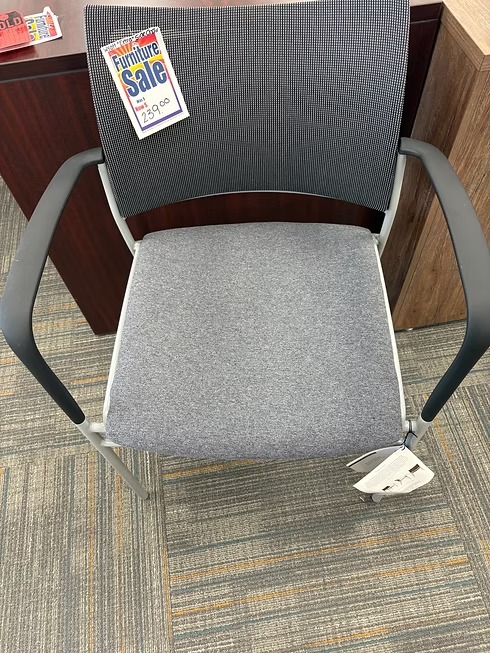 Gray and silver office chair with mesh back and padded seat, for sale.