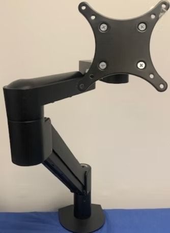 Black monitor arm with VESA mount, base, and adjustable joints against a white and blue background.