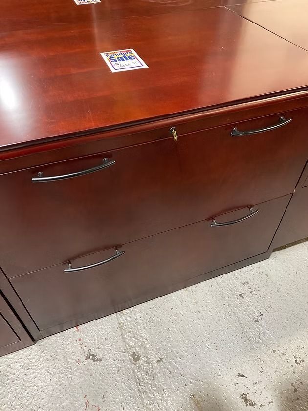 Dark wood office cabinet with two drawers and silver handles.