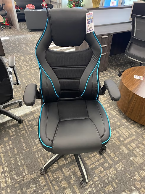 Black and blue gaming chair on carpet, in a furniture store.