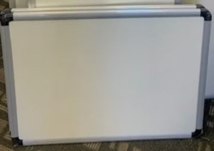 Whiteboard with silver frame.