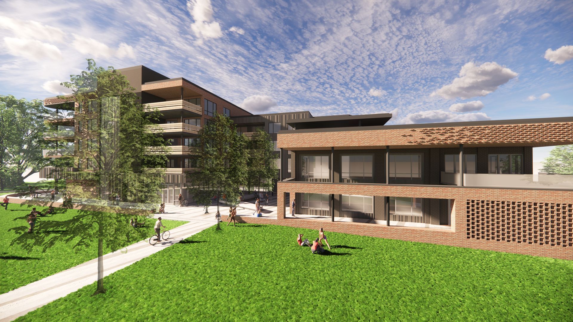 Modern buildings with a grassy lawn. People walk and sit under a blue sky with clouds.