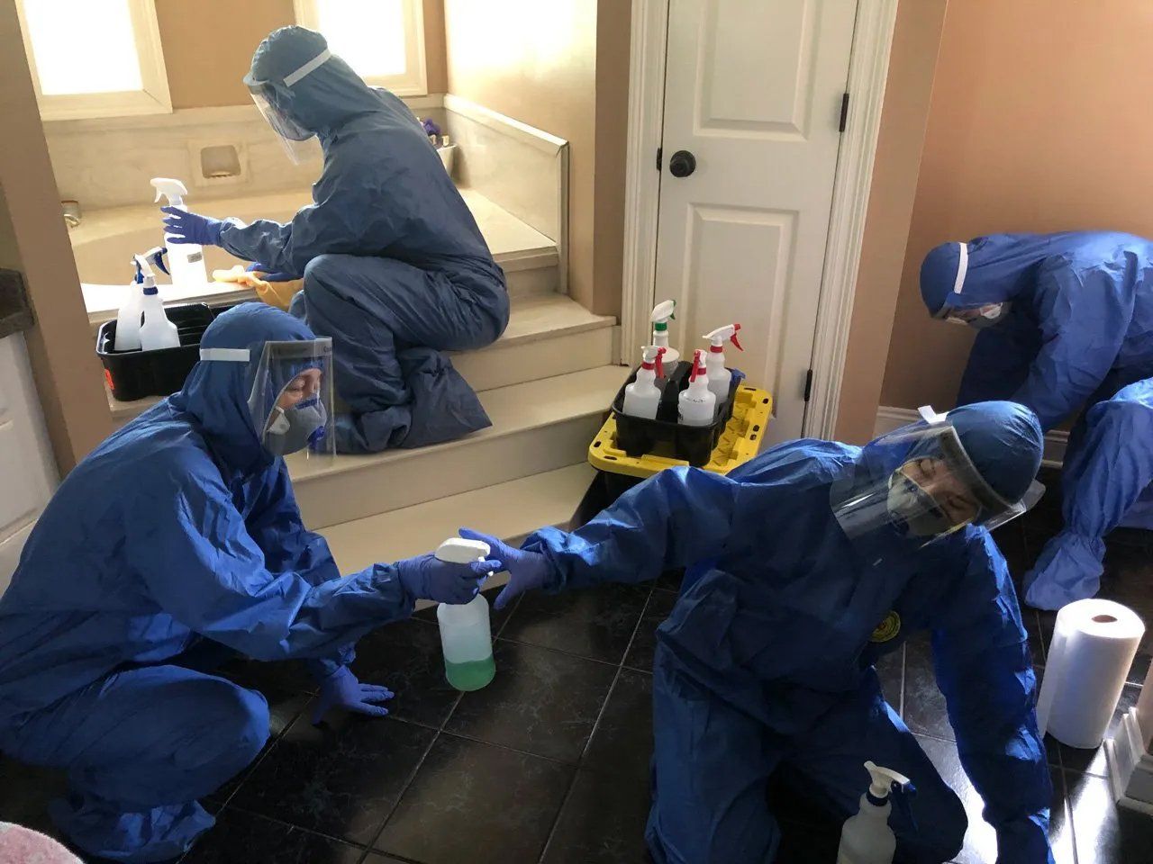 Biohazard Workers Cleaning the Floor