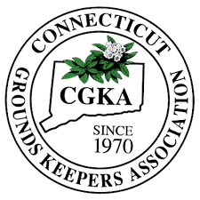 Connecticut Grounds Keepers Association logo: white circular seal with state outline and flower, black text.