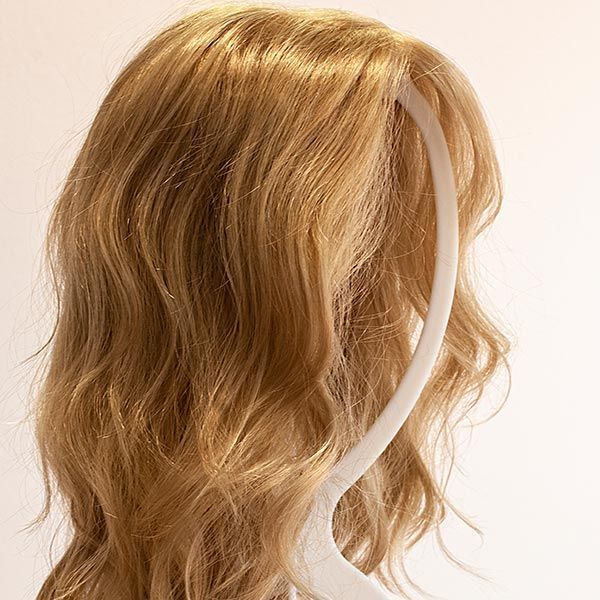 A close up of a blonde wig on a mannequin.