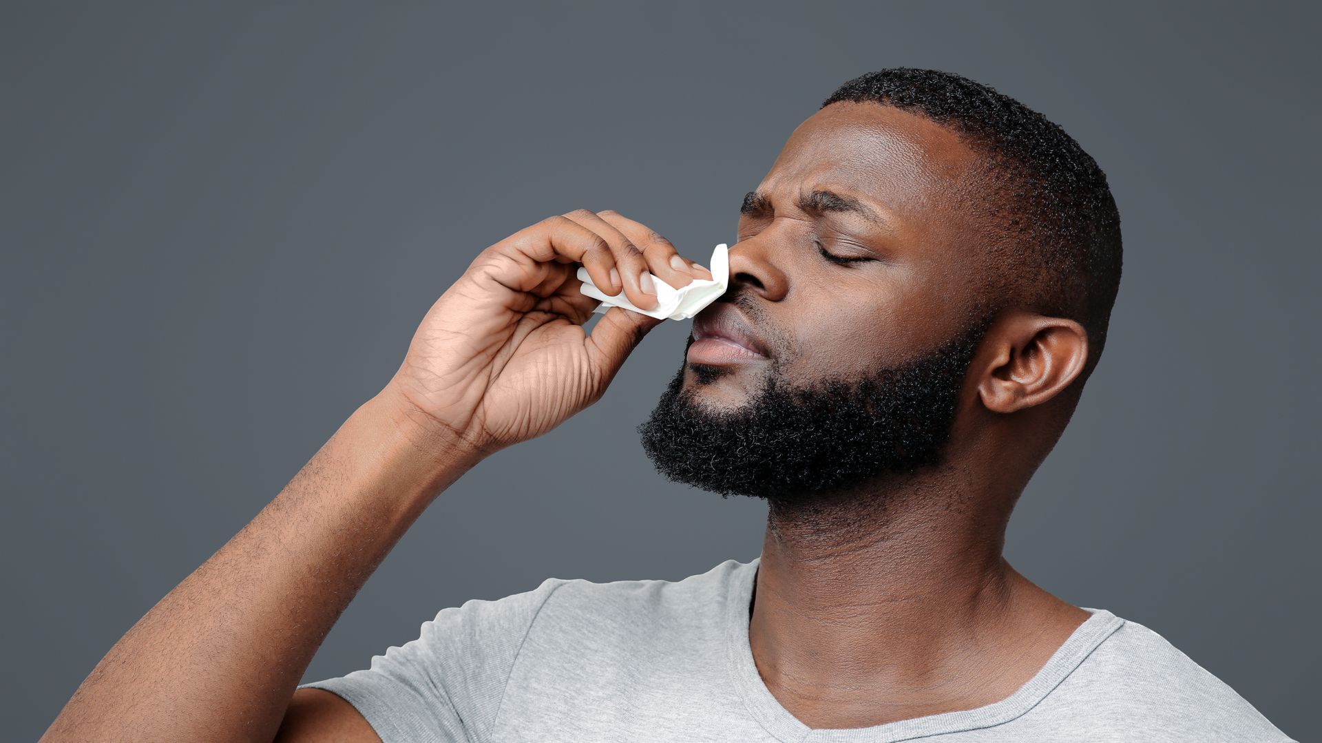 A man stopping nosebleed.