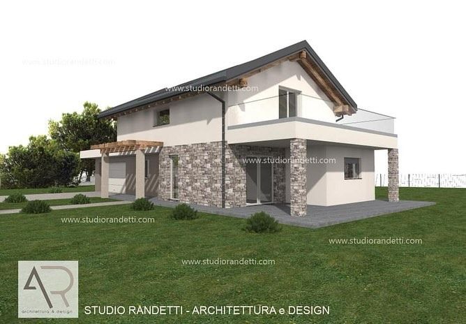Esterno di una moderna casa a due piani con pareti bianche, dettagli in pietra e tetto spiovente.