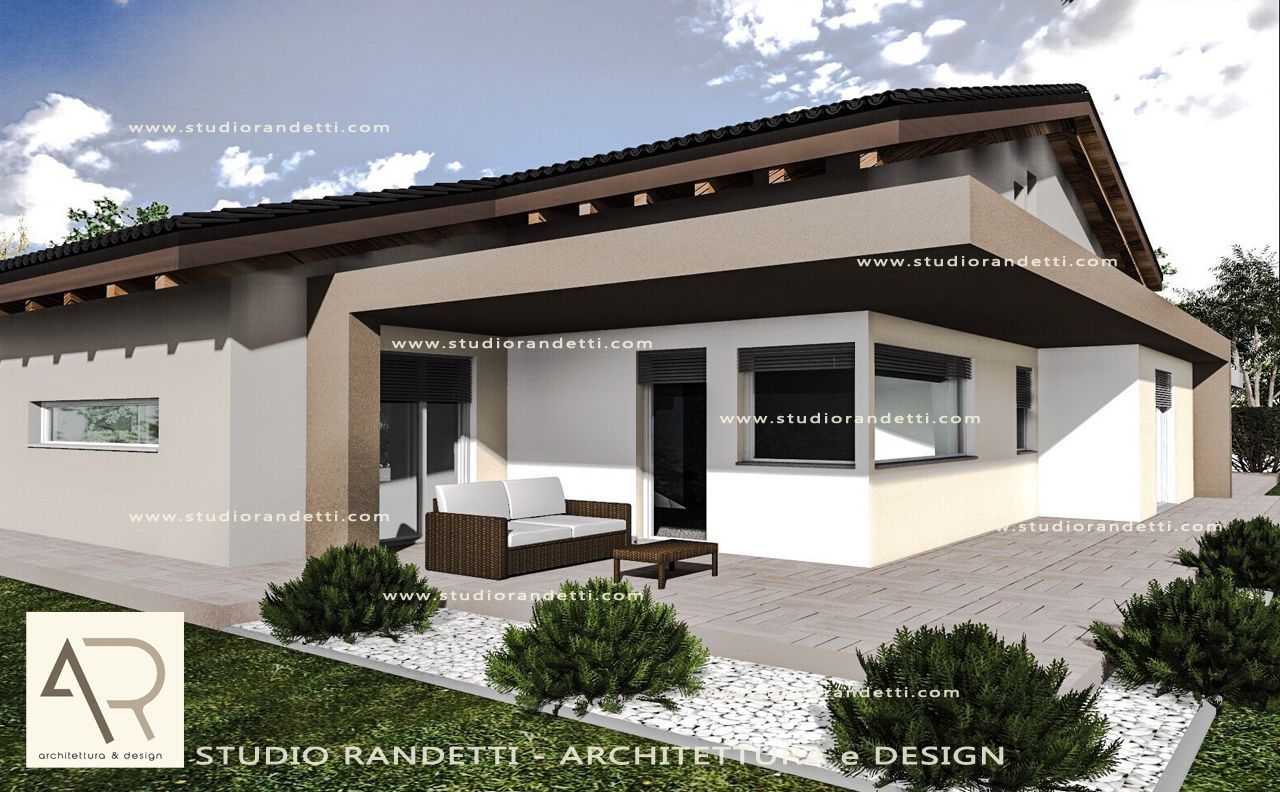 Esterno di una moderna casa a un solo piano con pareti beige, tetto scuro e portico anteriore coperto con posti a sedere all'aperto.