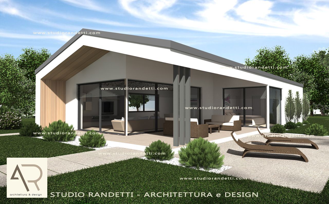 Esterno di una casa moderna con tetto spiovente, patio in vetro e giardino paesaggistico sotto un cielo luminoso