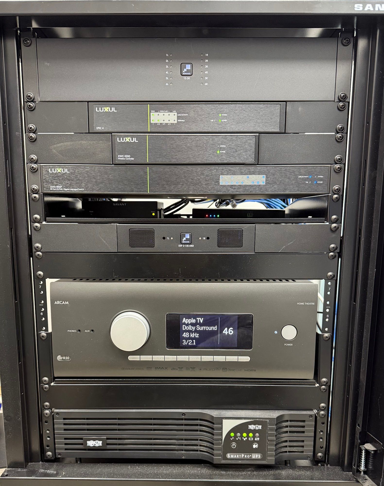 Black server rack with audio/visual equipment.