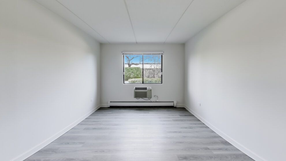 photo of bedroom alternate angle showing the length of the room