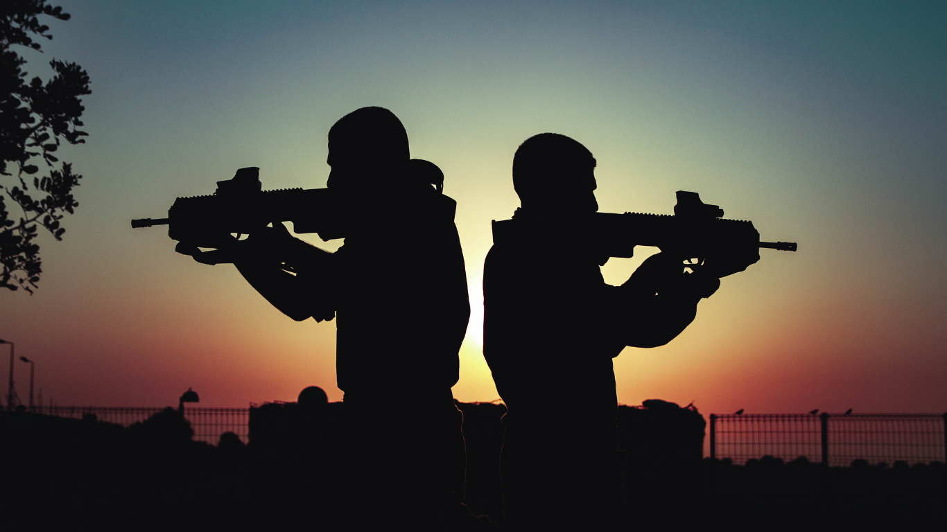 two men holding guns