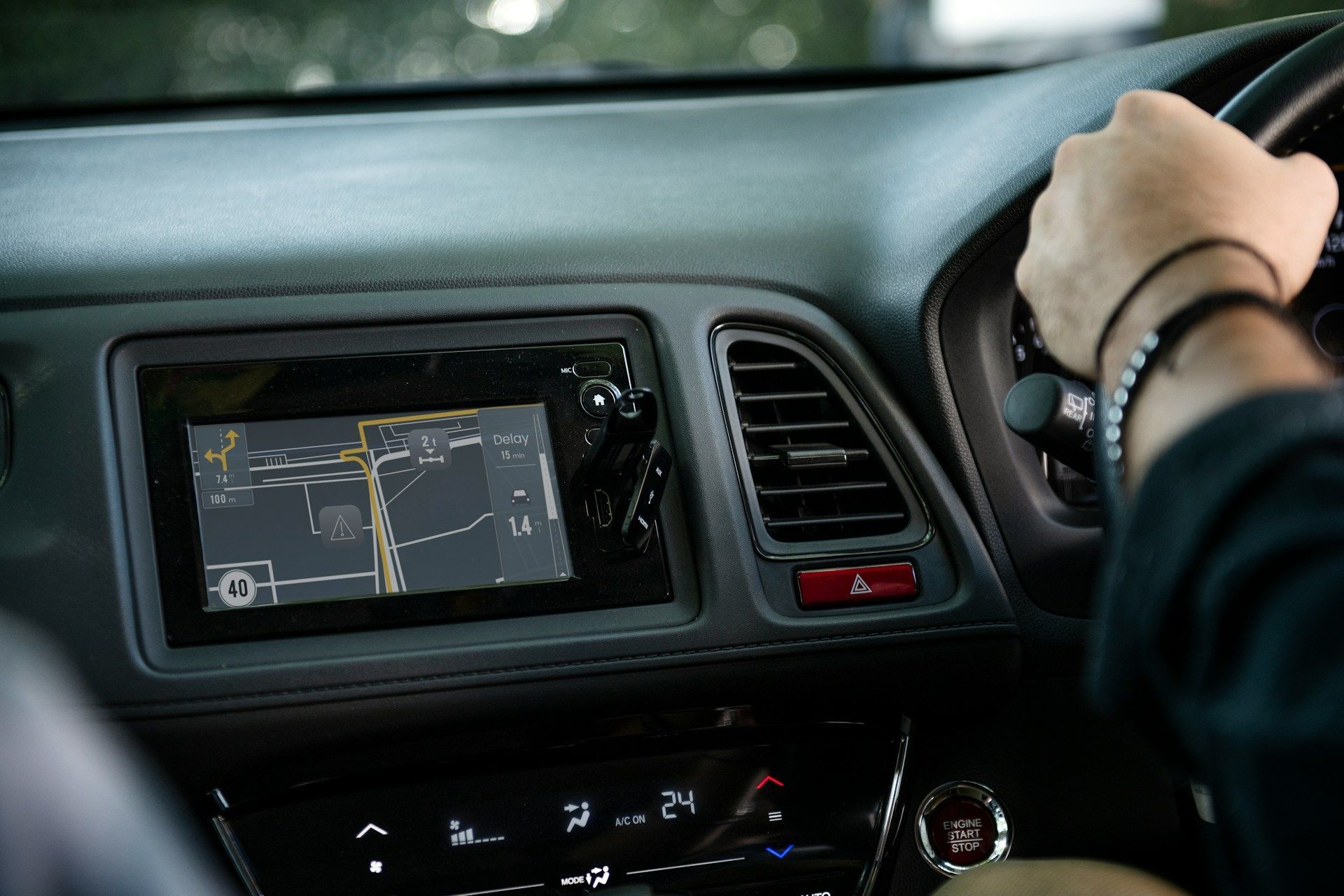 An aerial view of a man pushing a pallet truck in a warehouse.
