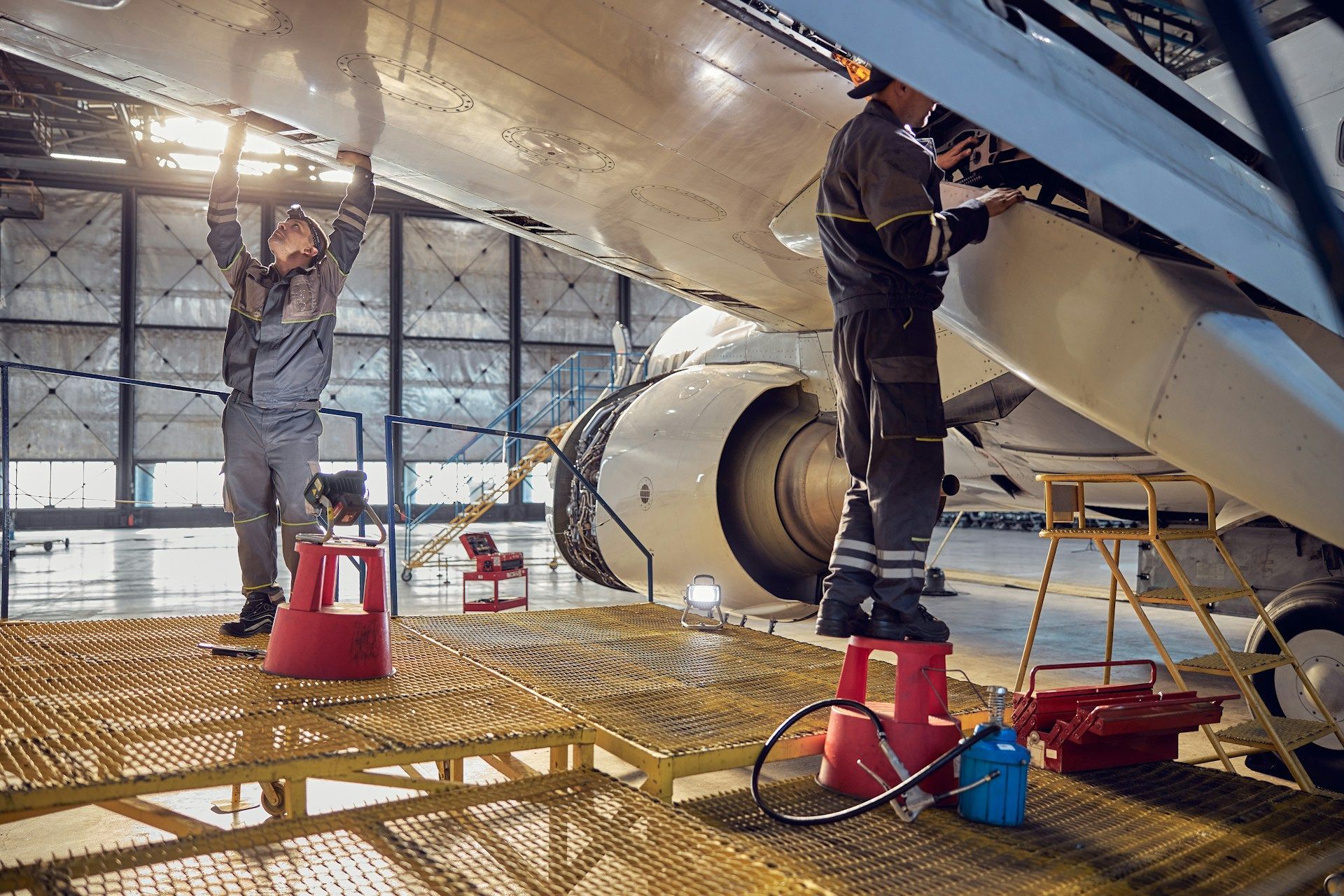 An aerial view of a man pushing a pallet truck in a warehouse.