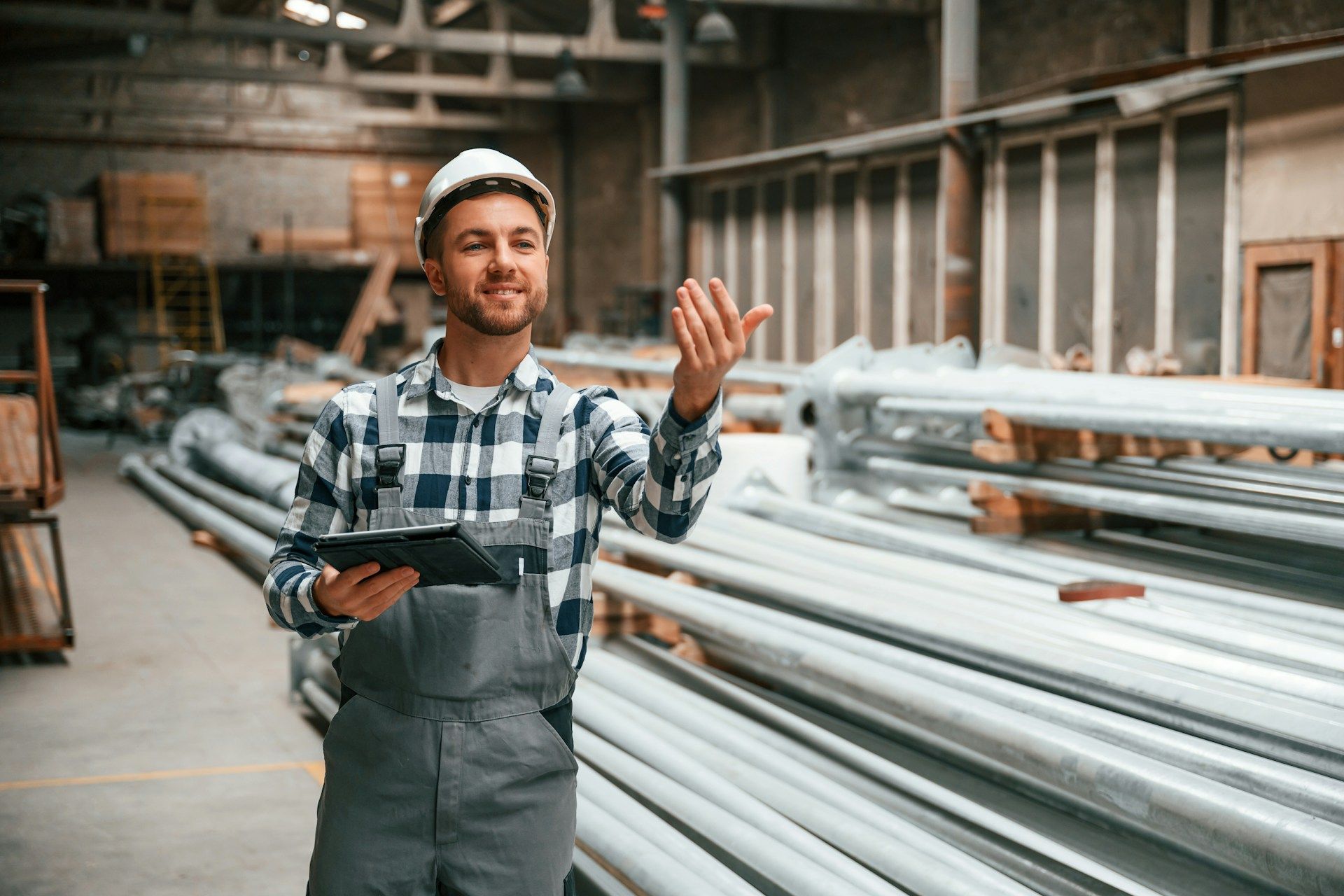 A man and a woman are hugging in front of a house.