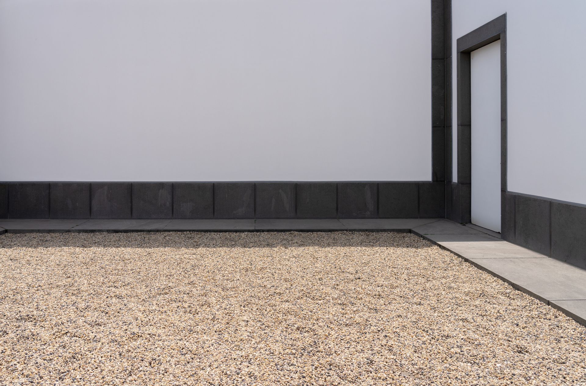 Fresh gravel spread across a yard.