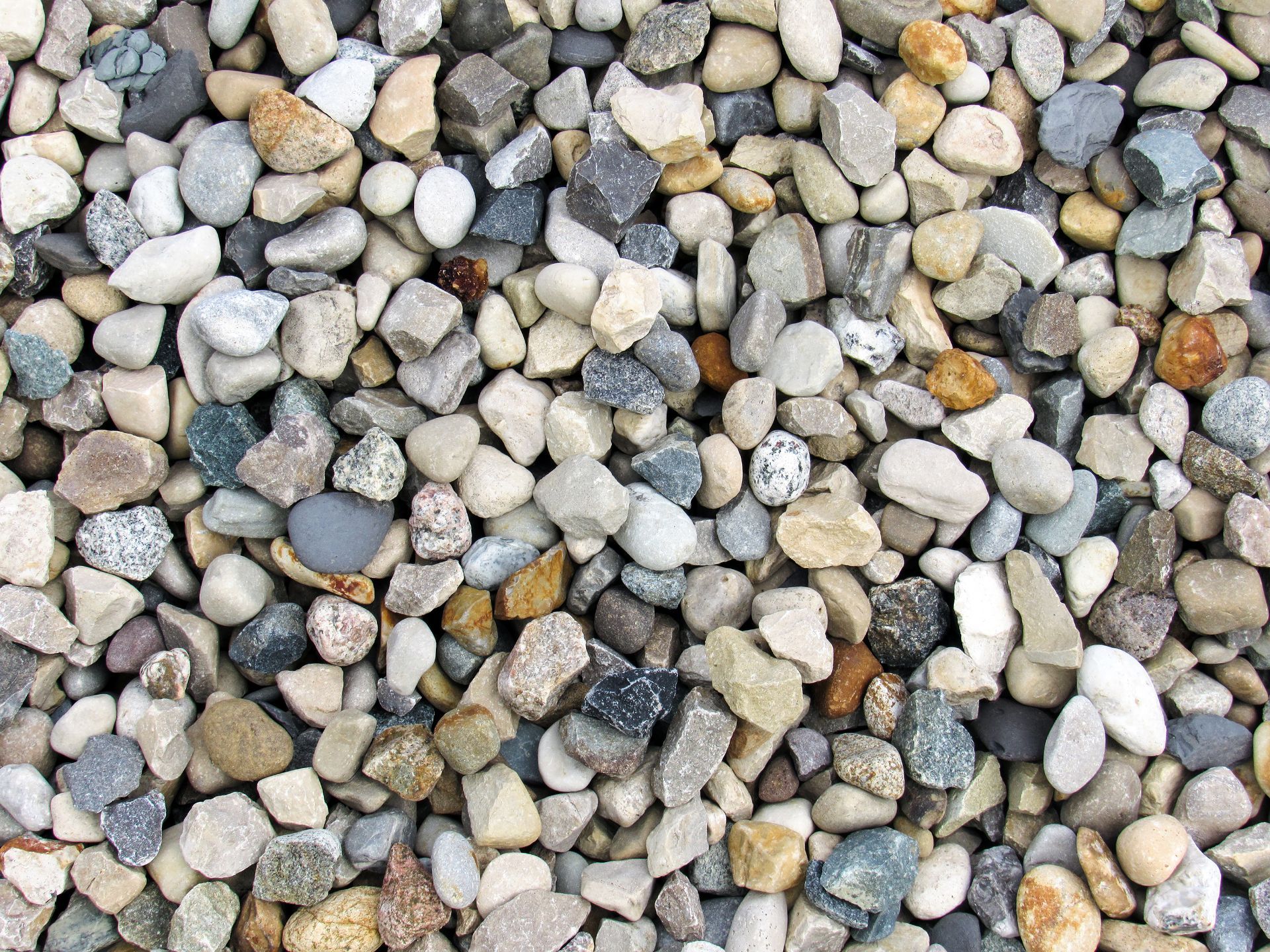 Close-up of crushed grey stone aggregate, perfect for gravel delivery and driveway projects.