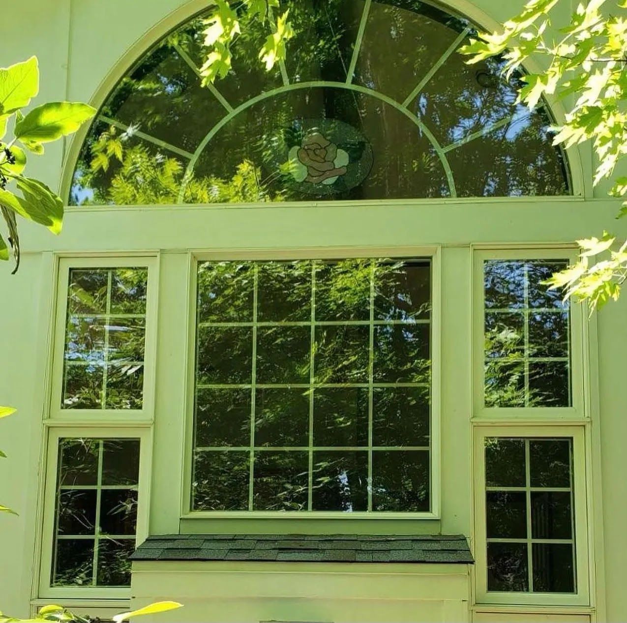 A window with a stained glass design on it
