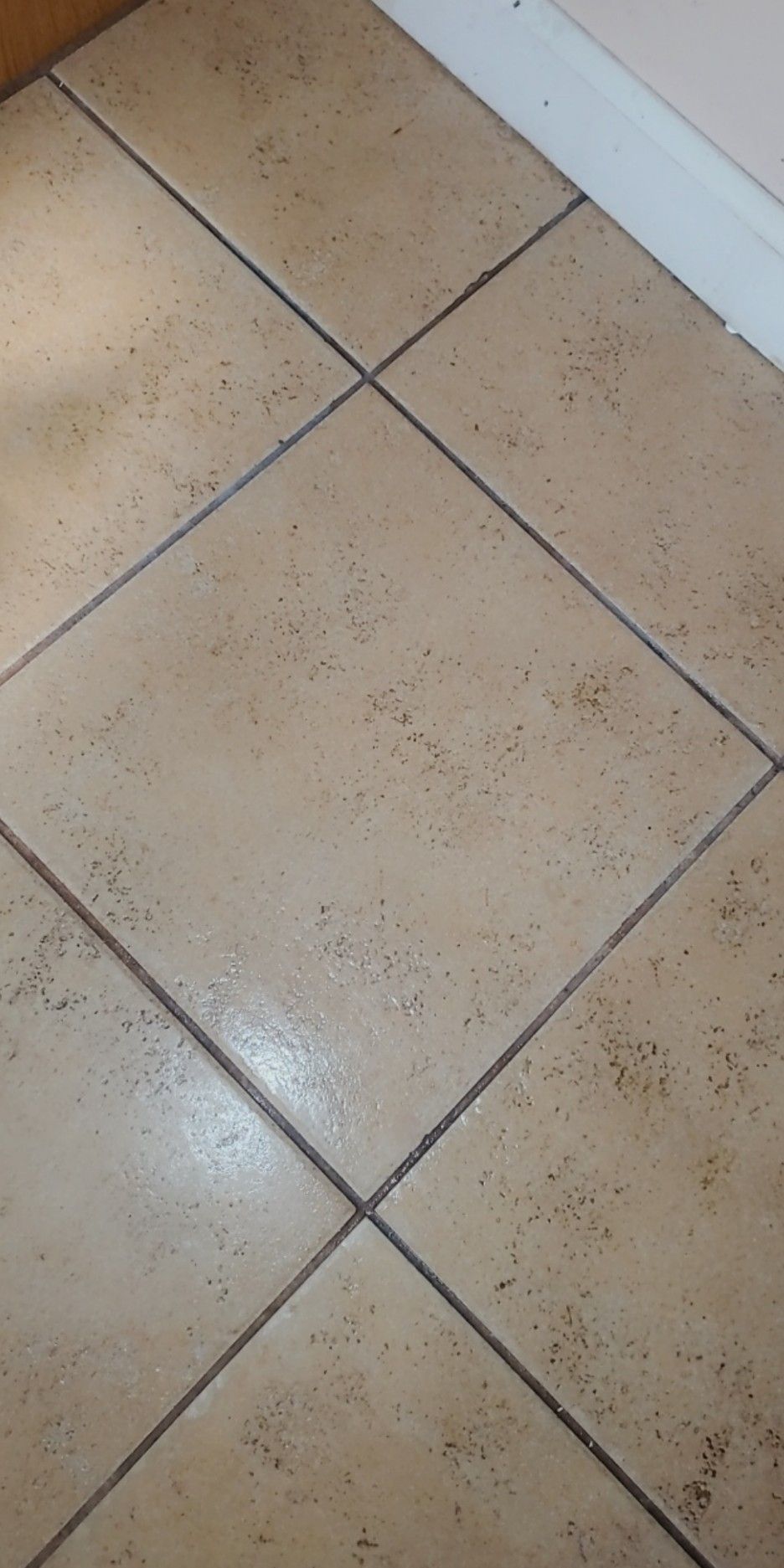 A close up of a tiled floor in a room.