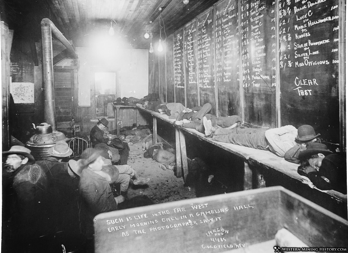 EARLY MORNING, SLEEPING GAMBLERS IN MINING TOWN