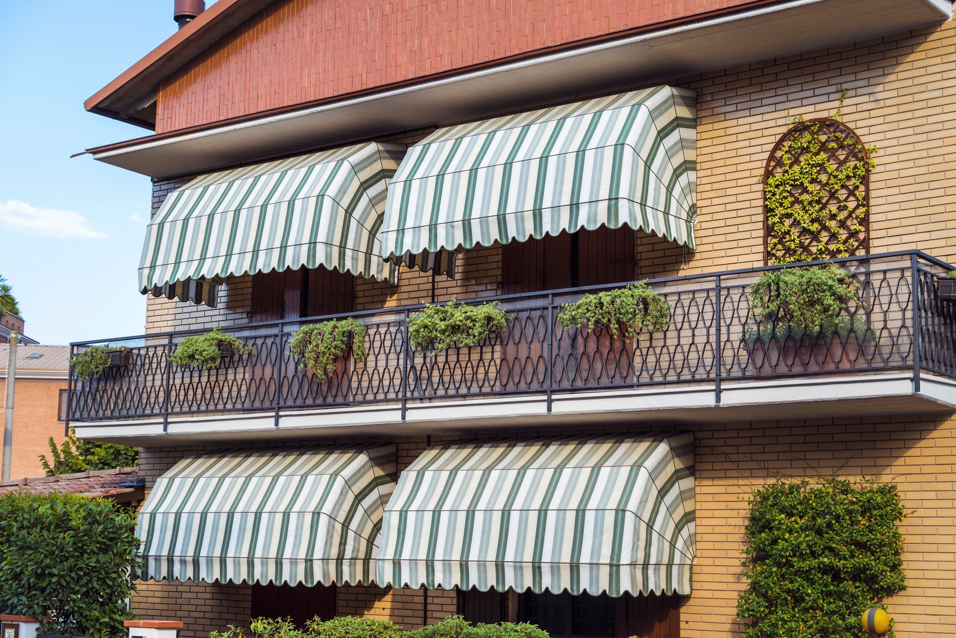 House with Balconies with Striped Awnings | Awnings for Homes | Bloomington, MN