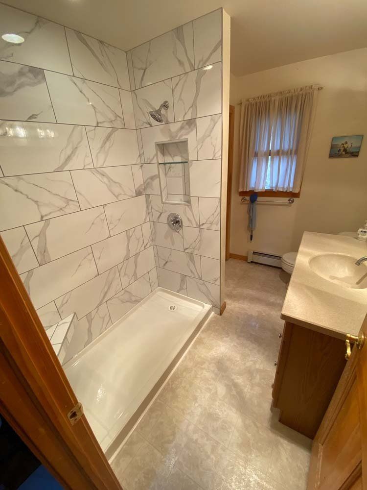 Heated Floors, Tub To Shower Conversions, Grout Free, Countertops, Cabinets, steam showers, Tile, Whole Wall Marble Shower Surrounds, Build A Bath & Kitchen