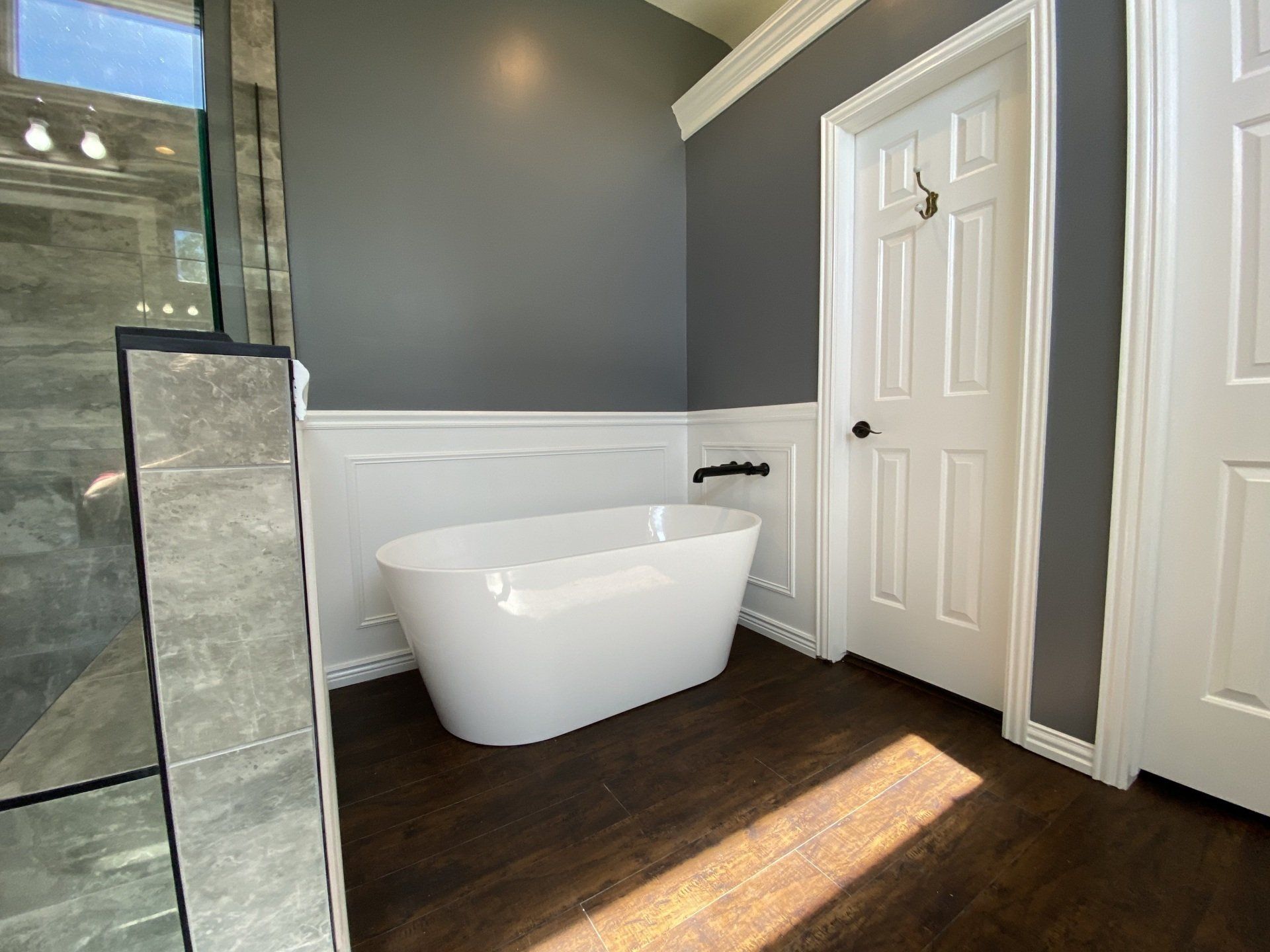 There is a bathtub in the middle of the bathroom.