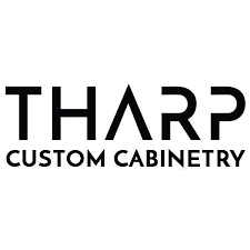 The logo for tharp custom cabinetry is black and white.