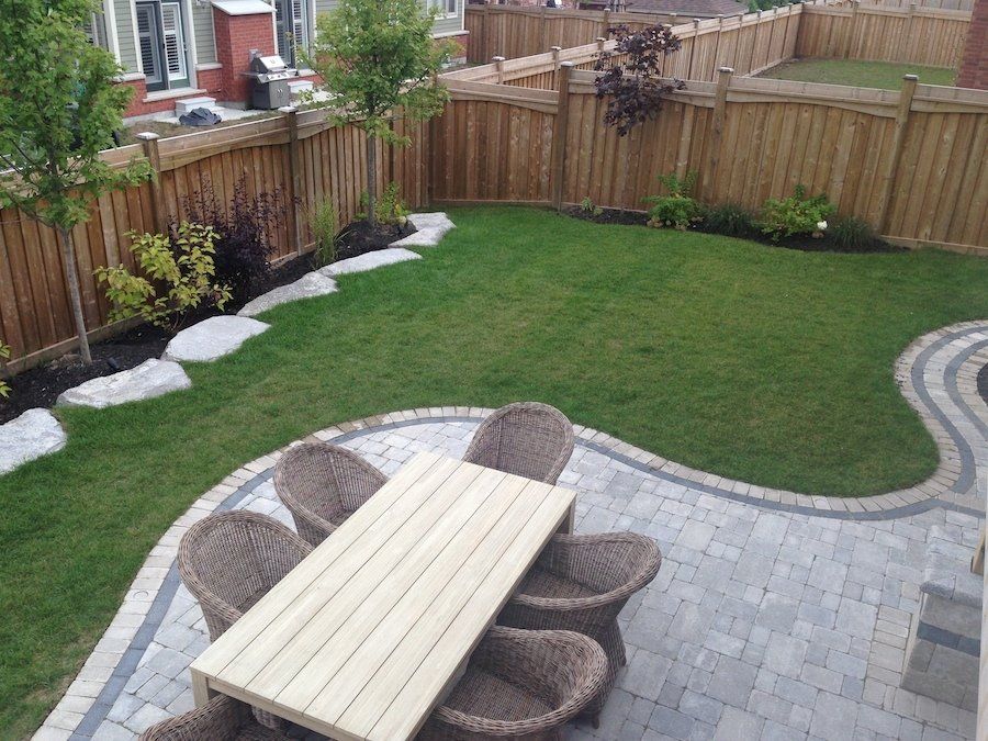 An aerial view of a backyard with a table and chairs