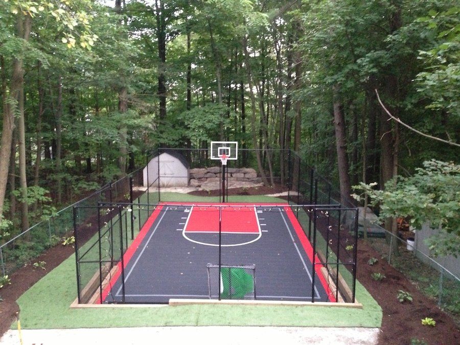 A basketball court in the middle of a forest