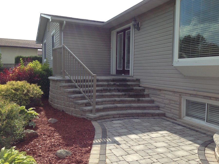 A house with stairs leading up to the front door