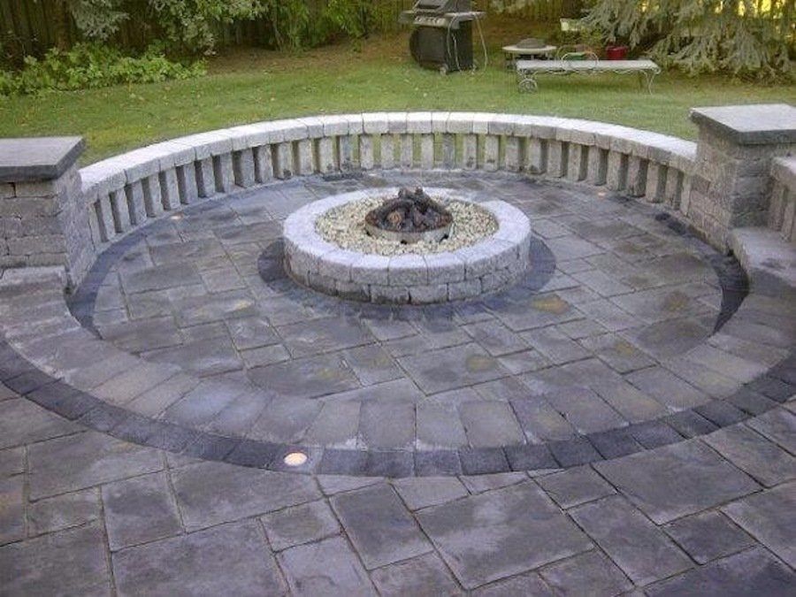There is a fire pit in the middle of the patio.