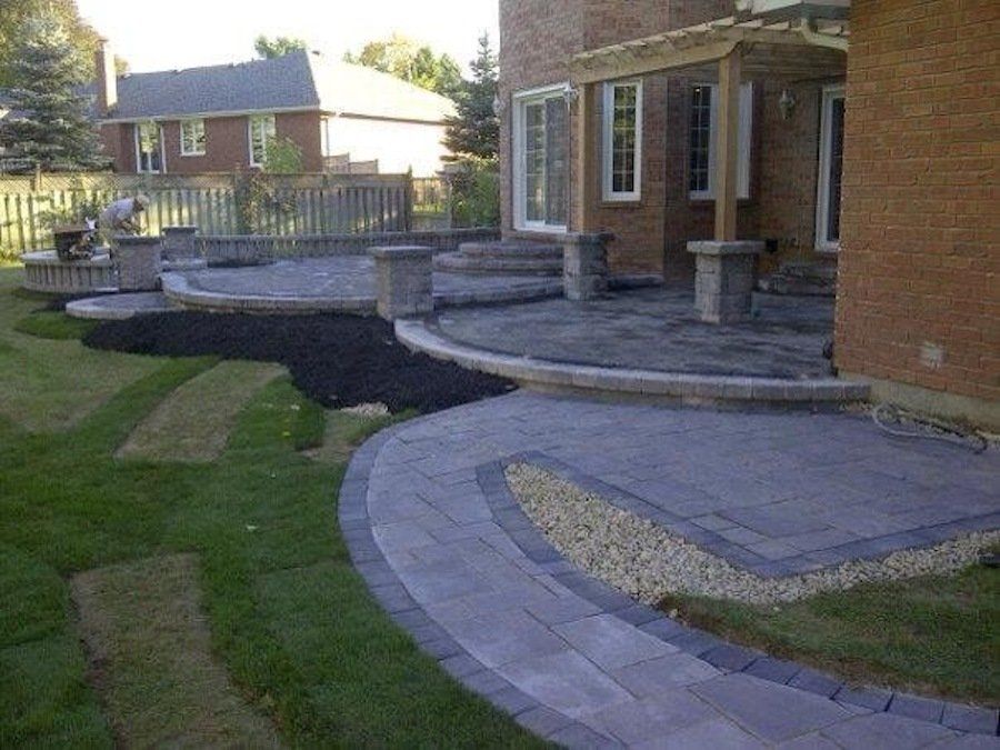 A brick house with a patio in front of it