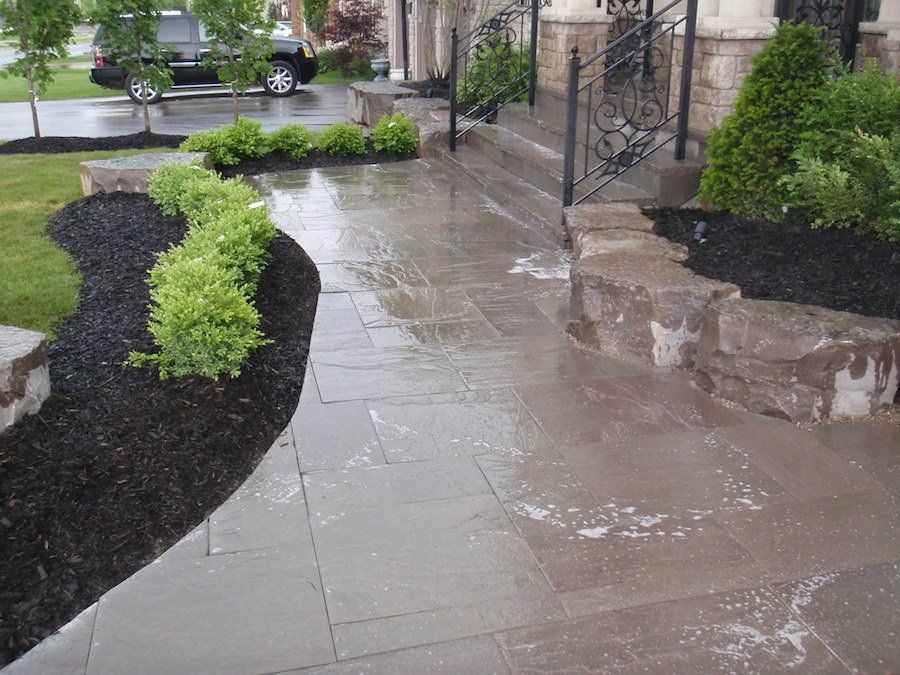 A patio with a car parked on the side of it