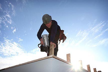 Worker on the roof - Roofing Contractors in Baytown, TX