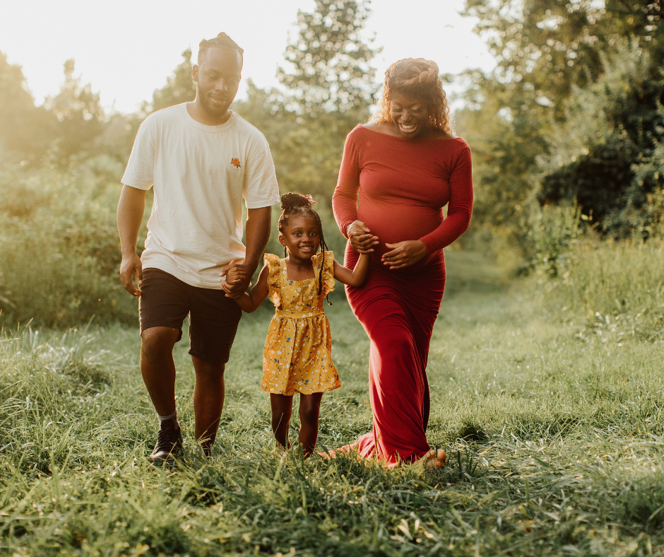 Family photograph with a mom, dad and daughter