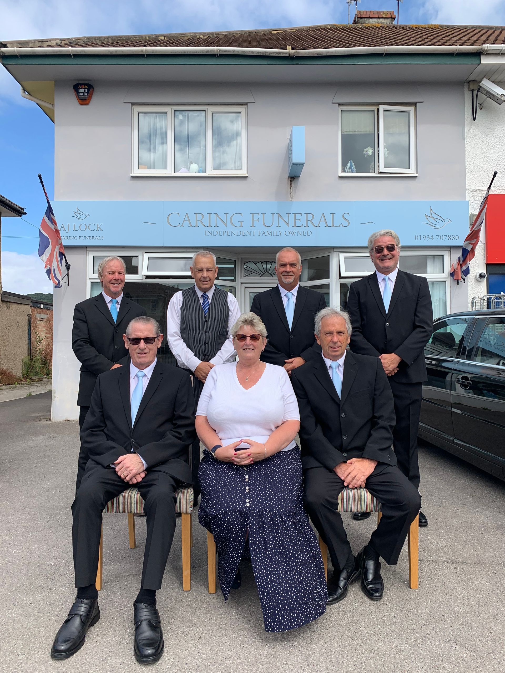 AJ Lock carning funeral team standing outside their weston super mare funeral directors branch