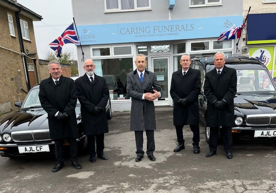 AJ Lock carning funeral team standing outside their weston super mare funeral directors branch
