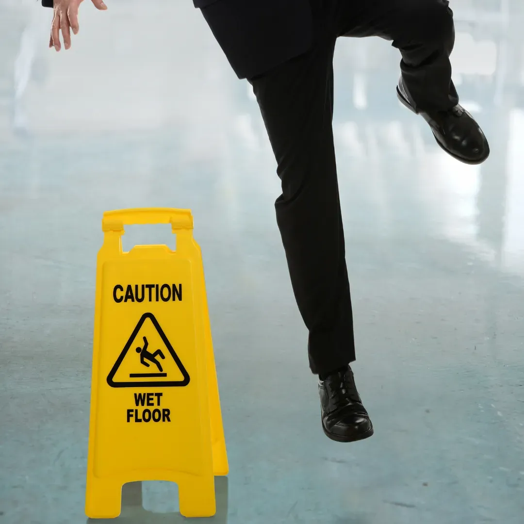Man slipping on water due to floor without anti slip tile coating.
