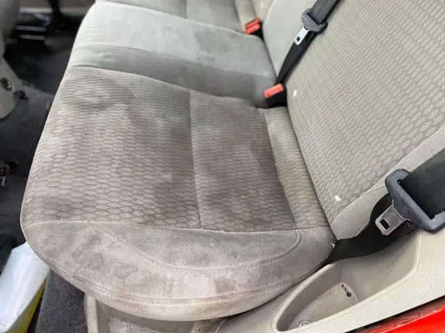 Car interior dirt stain removal and cleaning service.
