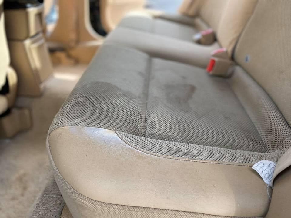 Before automobile upholstery cleaning service.